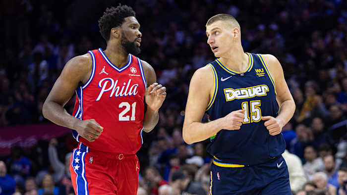 Philadelphia 76ers center Joel Embiid (21) and Denver Nuggets center Nikola Jokic.